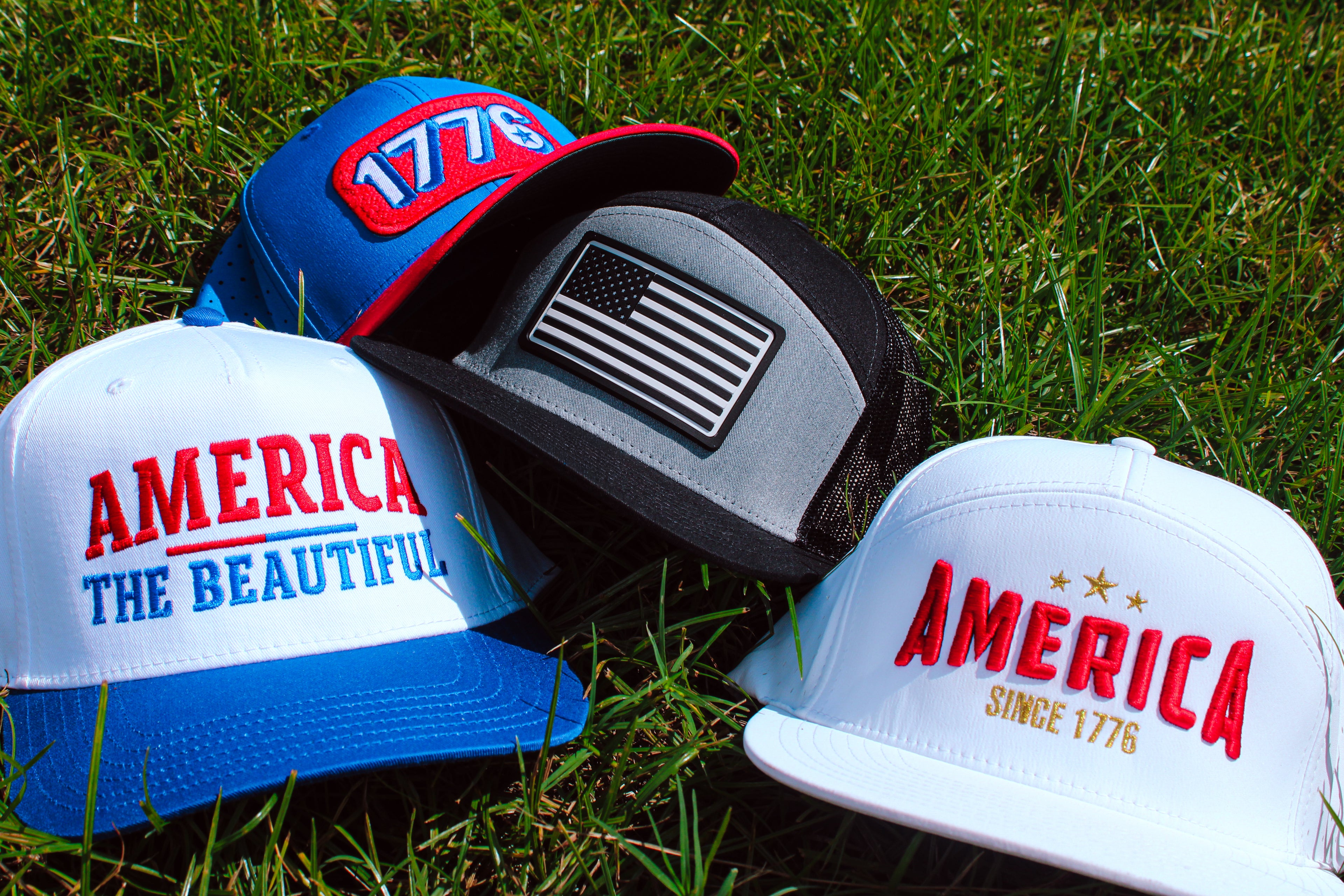 american themed hats layered in the grass flat